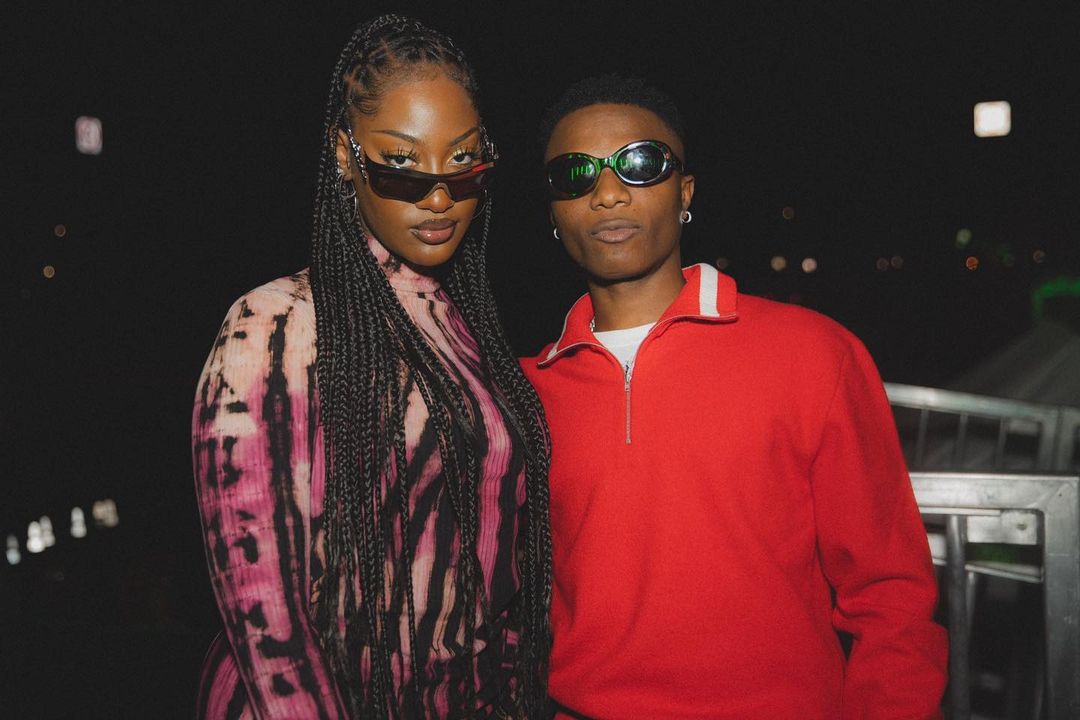 Tems and Wizkid pose for a photo